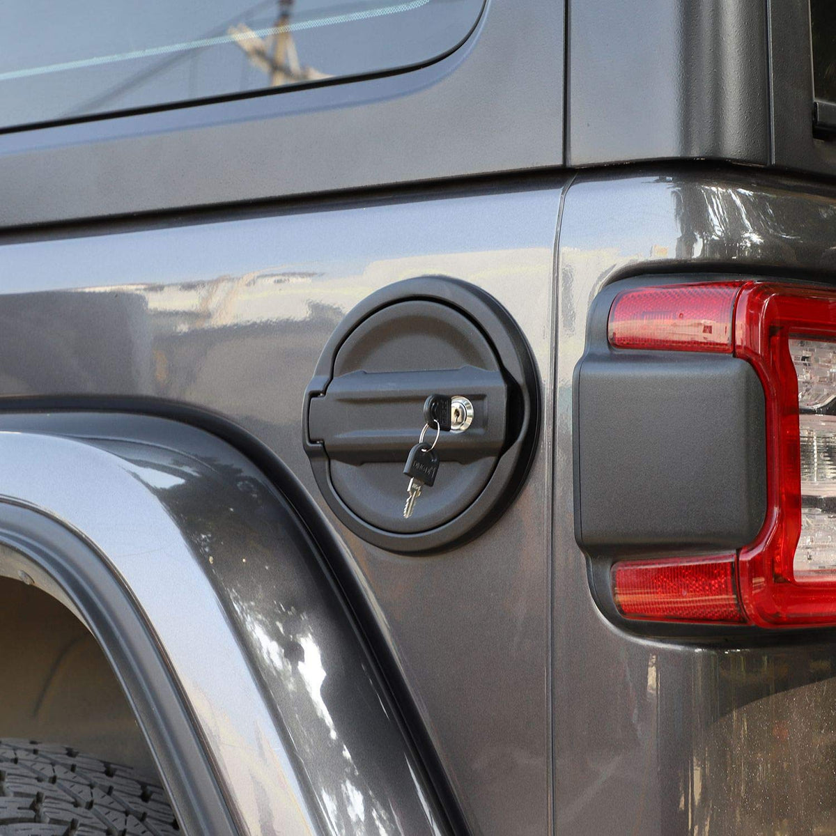 JeCar locking mechanism with key next to cover showing theft-resistant security feature
