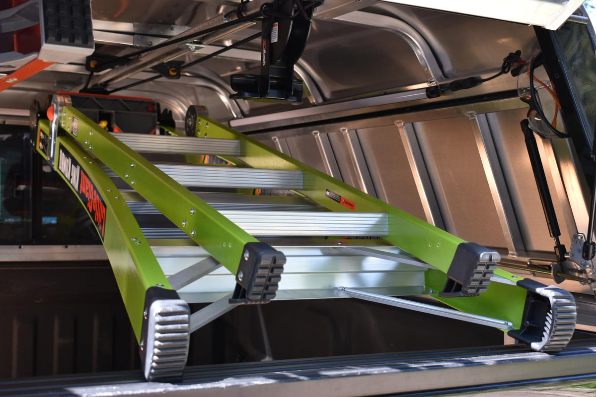 JET Rack ceiling-mounted inside van showing organized ladder storage and space saved