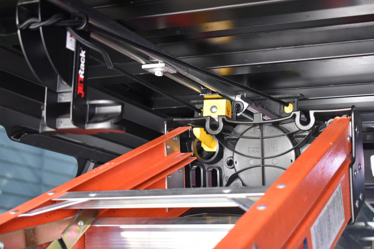 JET Rack holding A-frame ladder in use showing fast loading and protected cargo