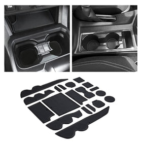 JKCOVER front packaging and full 19-piece kit protecting Tacoma interior