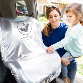 J.L. Childress cover beside infant car seat showing fit and scale
