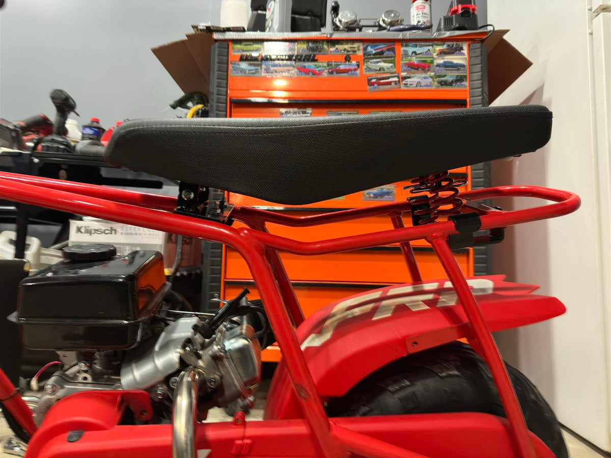 JMCHstore rider using sprung seat off-road showing reduced impact and smoother ride benefit
