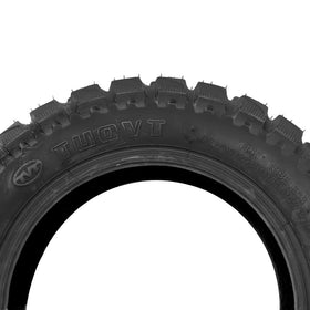 JXMOTO tire next to ruler for clear 90/65-6.5 size and scale confirmation benefit
