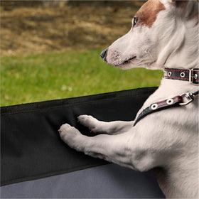 K&H lifestyle image with dog in backseat and protected door for interior protection