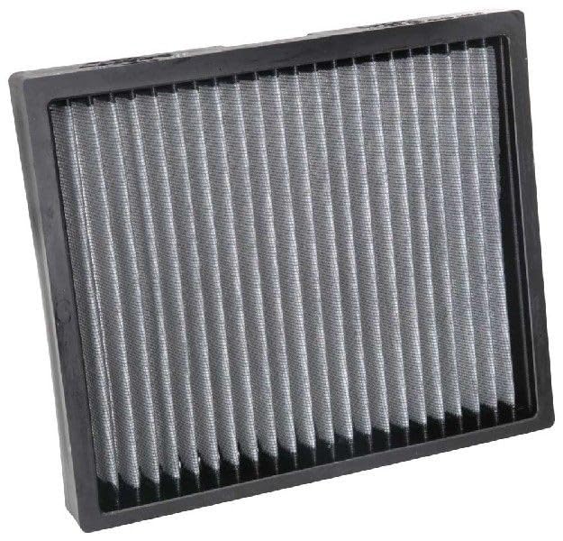 K&N filter being rinsed under water to show washable reusable maintenance