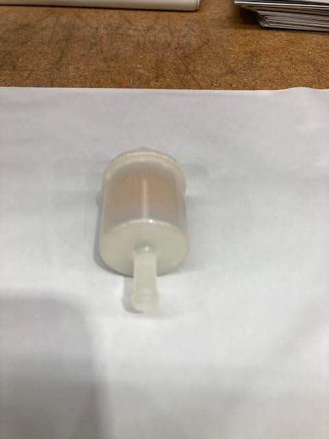 Kawasaki fuel filter installed on engine hose demonstrating proper connection