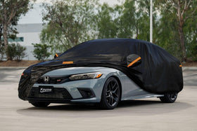 kayme covered Honda Civic outdoors in snow demonstrating all-weather shielding