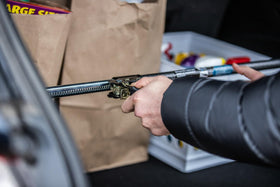 KEEPER bar beside measuring tape showing adjustable 40 to 70 inch range
