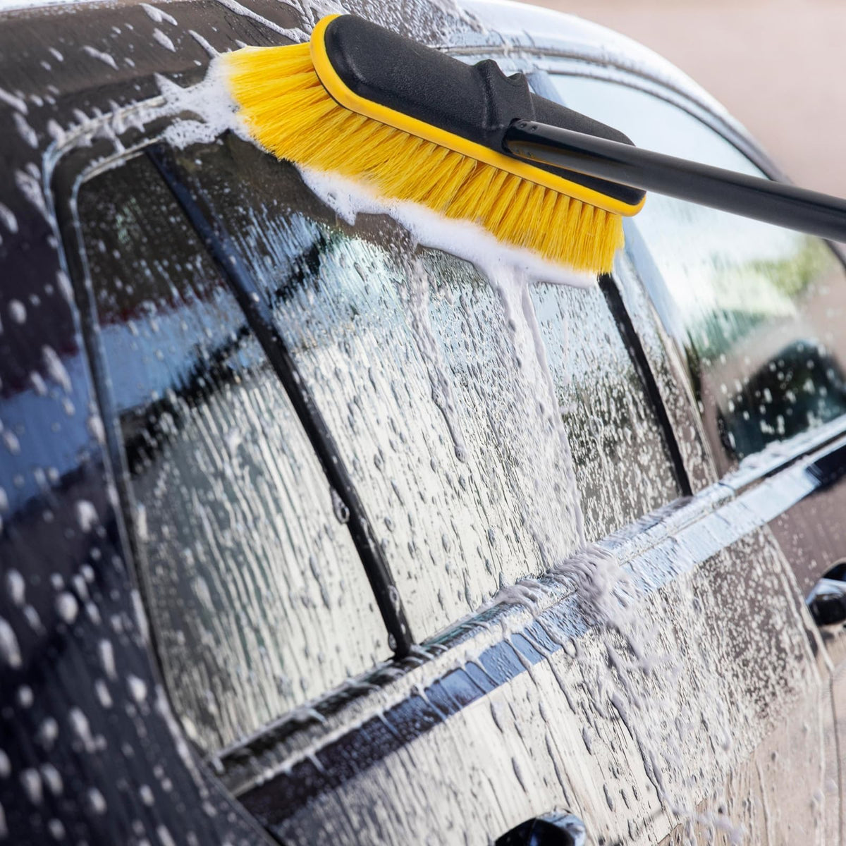 KeFanta brush gently washing a solar panel for streak-free results