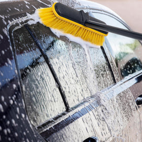 KeFanta brush gently washing a solar panel for streak-free results