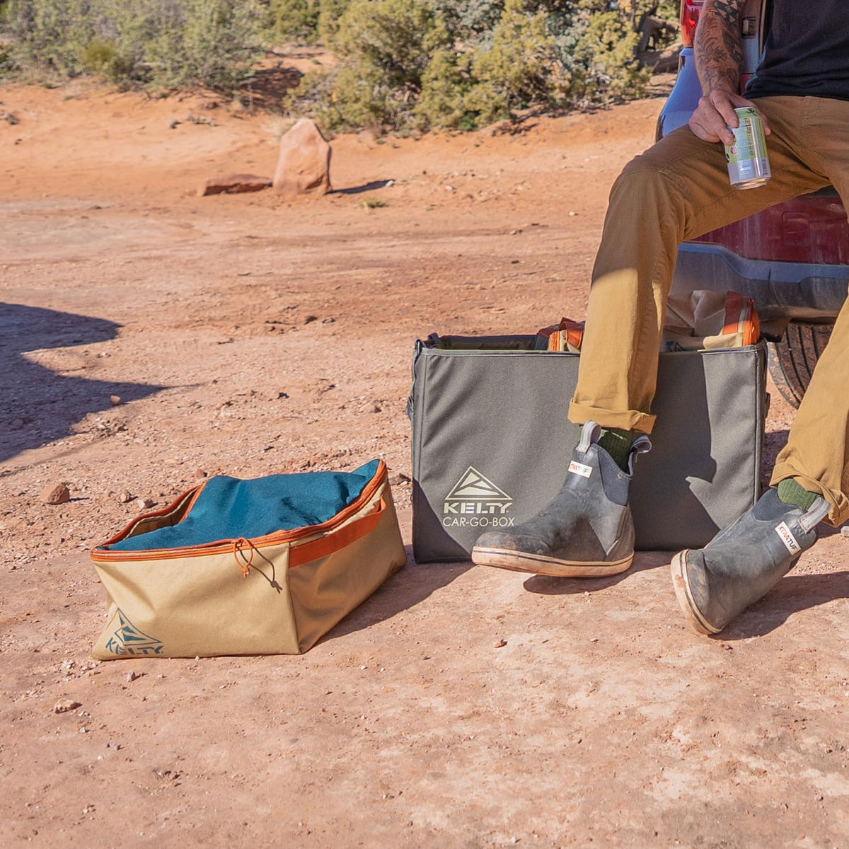 Kelty cargo box next to gear for size comparison and packing capacity benefit