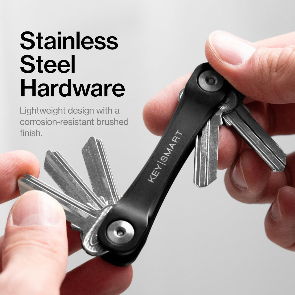 KeySmart next to wallet to show pocket-friendly scale and convenience