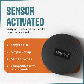 KIDZALERT next to hand for scale demonstrating compact, portable size