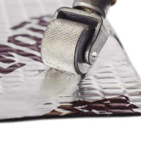 KILMAT laid out on floor with ruler to show coverage and scale benefit