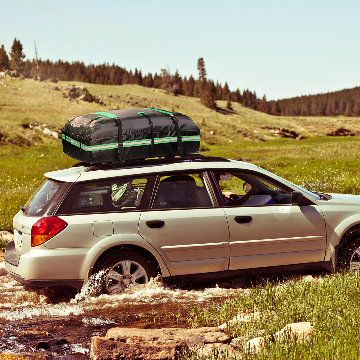 Kingfun rooftop carrier on car at campsite adding weatherproof storage