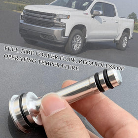 Kiniezergo bypass barbell installed in transmission housing demonstrating leak-free fit