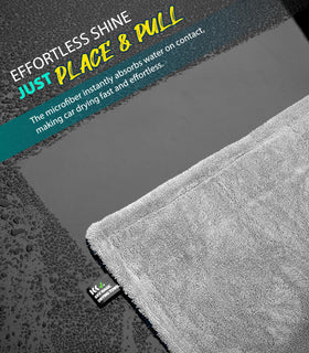 KKV towel next to SUV tire showing full-size coverage and efficiency