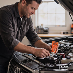 Klear Concepts tube in a garage setting with tools, showing professional automotive use benefit