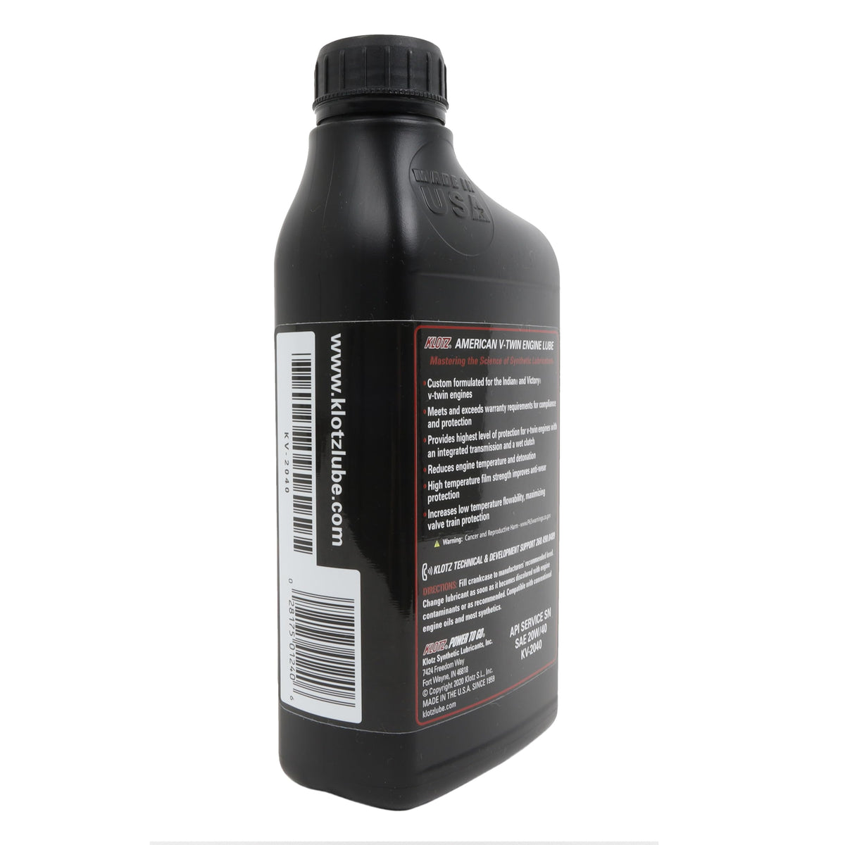 Pouring Klotz oil into Indian Thunderstroke engine during service for optimal lubrication