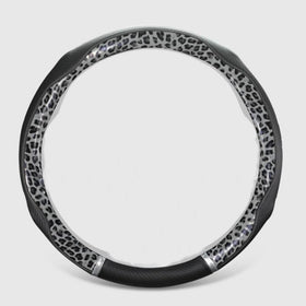 Knonip installed on steering wheel in car interior, improves comfort and control