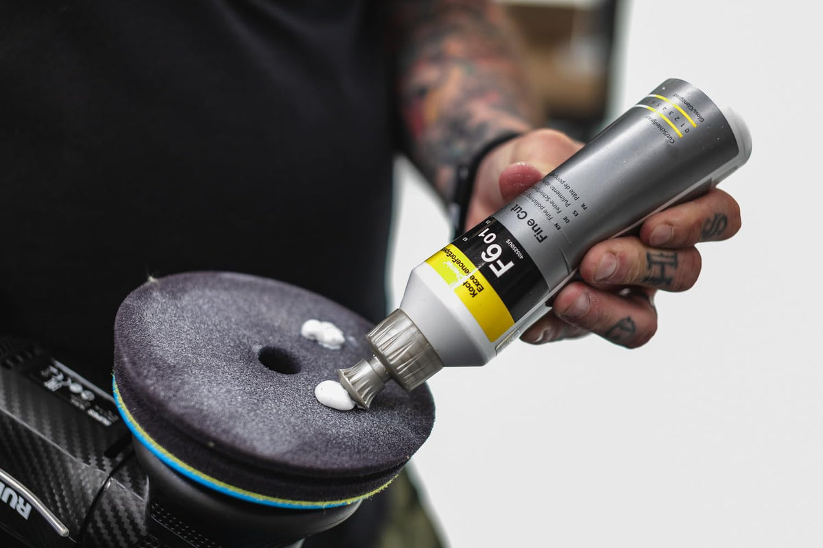 KOCHCHEMIE bottle placed beside a polished car demonstrating professional finish benefits