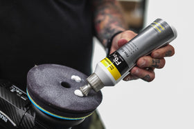 KOCHCHEMIE bottle placed beside a polished car demonstrating professional finish benefits