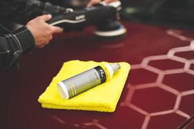 KOCHCHEMIE 250ml bottle next to a tape measure illustrating compact size and portable convenience