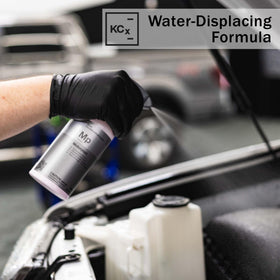 KOCHCHEMIE Motorplast being sprayed into an engine bay, protects components from moisture
