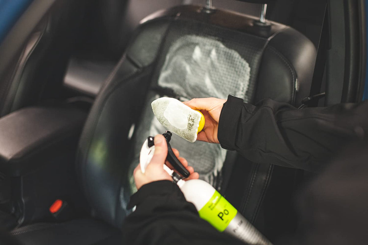 KOCHCHEMIE detailer applying cleaner in a professional workshop