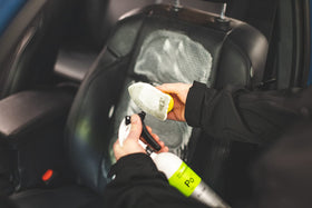 KOCHCHEMIE detailer applying cleaner in a professional workshop