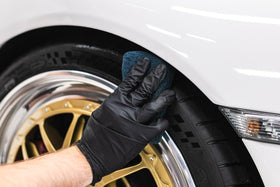 Wheel and tire with high-gloss KOCHCHEMIE finish in lifestyle setting showing showroom shine