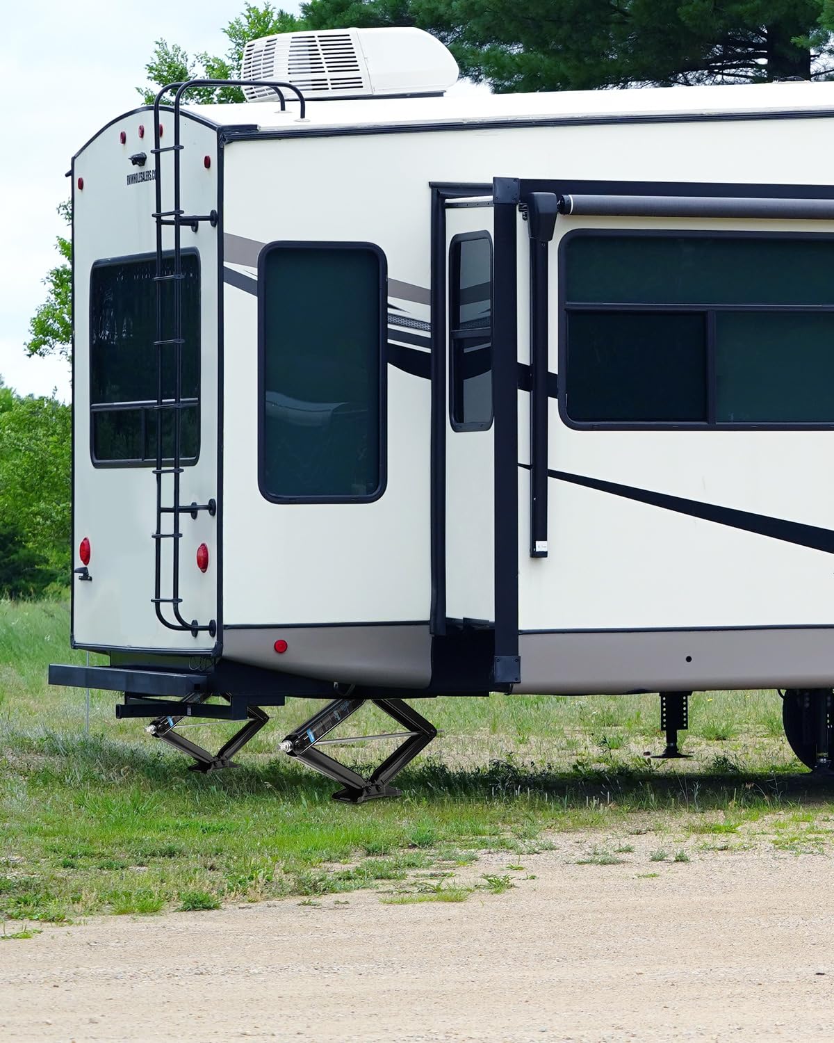 Kohree jacks installed at campsite offering safer, wobble-free leveling