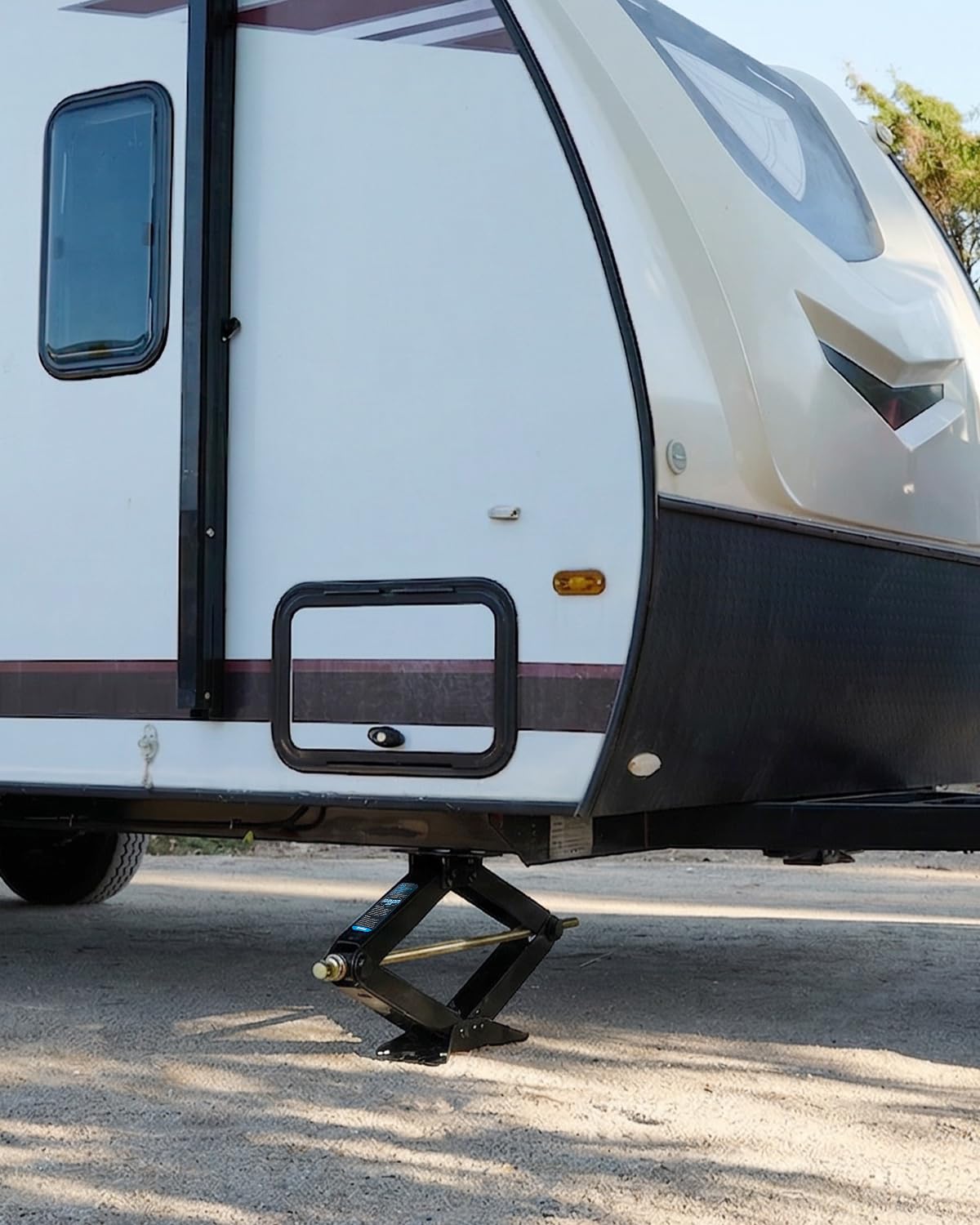 Kohree stabilizers in campsite scene reducing RV sway and improving comfort