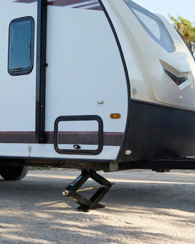 Kohree stabilizers in campsite scene reducing RV sway and improving comfort