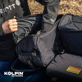 Kolpin Matrix Seat Bag next to helmet for size comparison showing compact capacity benefit