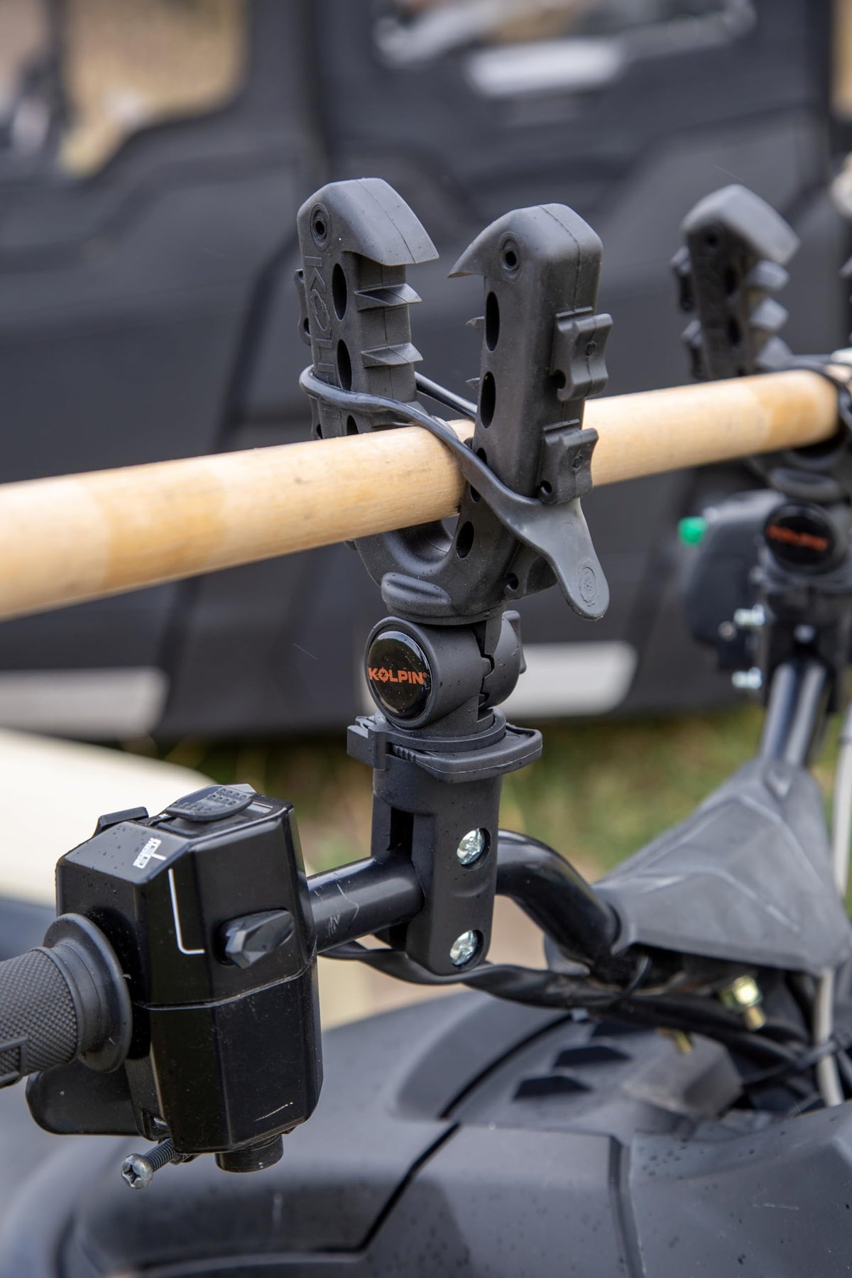 Kolpin Rhino Grip XL mounted on ATV handlebar showing stability and quick access benefit
