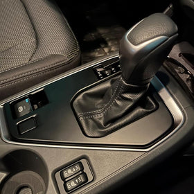 Kolya cover in use around gear shift preserves full control access