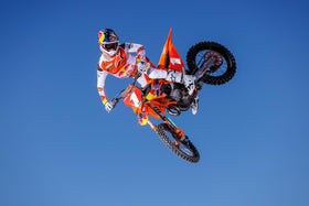 KTM filter with off-road bike in background showing pro-level maintenance benefit