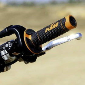 KTM grips next to ruler showing size and fit for 22–28mm handlebars