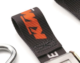KTM strap beside ruler for scale showing durable 1.5 inch webbing strength