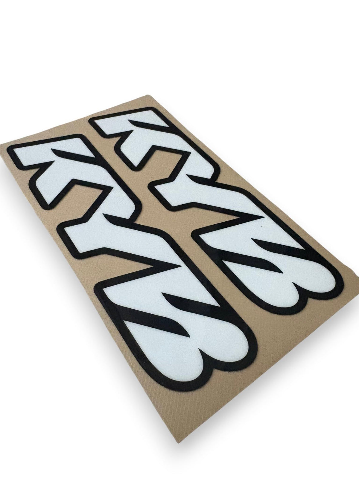 Generic KYB chrome stickers on bike in trail setting showing styled appearance
