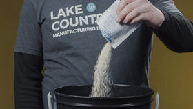 Lake Country measuring powder into bucket for accurate, mess-free mixing