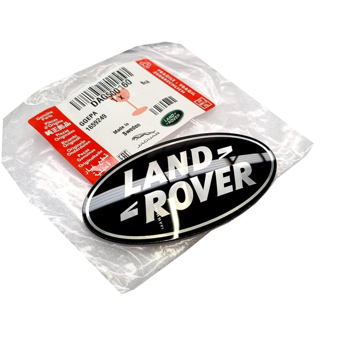 Land Rover front grille emblem shown installed, restores OEM look