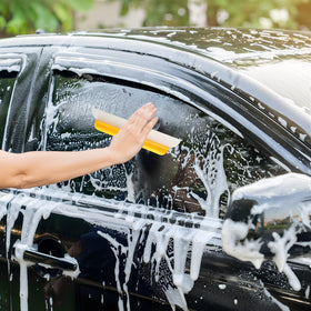 Lanties squeegee wiping a car windshield for faster, streak-free drying