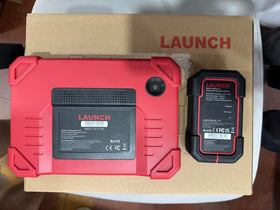 LAUNCH in-garage use demonstrating professional diagnostics on a workbench