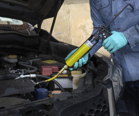 LEAKFINDER kit connected to car AC in use enabling fast leak detection benefit