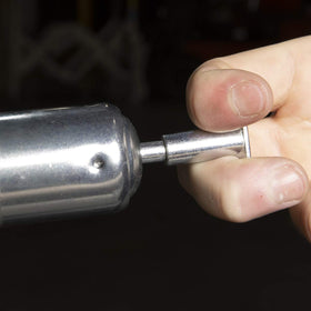 Legacy Manufacturing size comparison in hand showing compact tool for tight spaces
