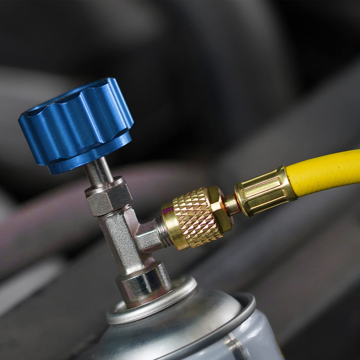 Lichamp self-sealing can tap close-up demonstrating leak minimization during can swaps