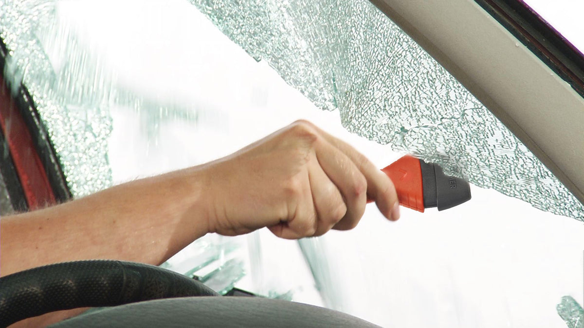 Lifehammer placed in car door within arm's reach demonstrating emergency readiness