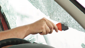 Lifehammer placed in car door within arm's reach demonstrating emergency readiness